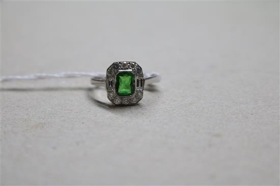 An 18ct white gold, green garnet? and diamond cluster ring, size N.